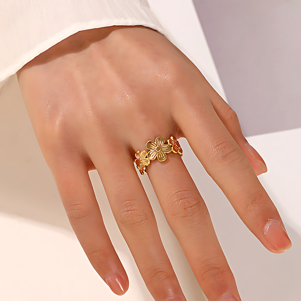 Meihua ring close-up showing sculptural open-band design