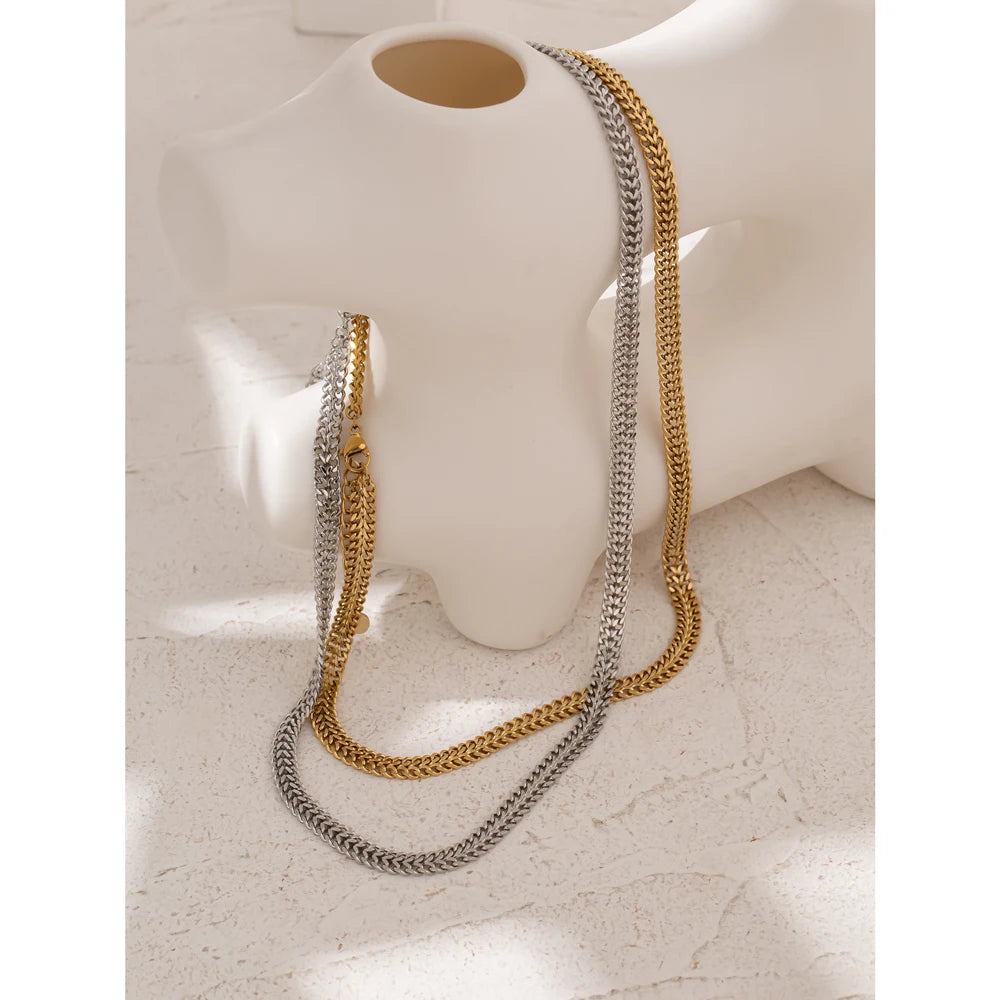 Close-up of polished gold-tone necklace surface