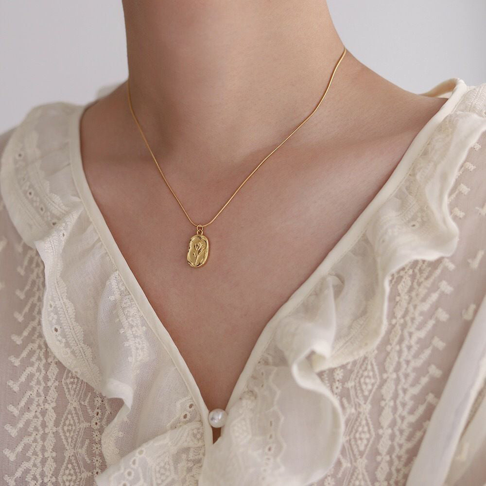 Roselove necklace displayed on a neutral background