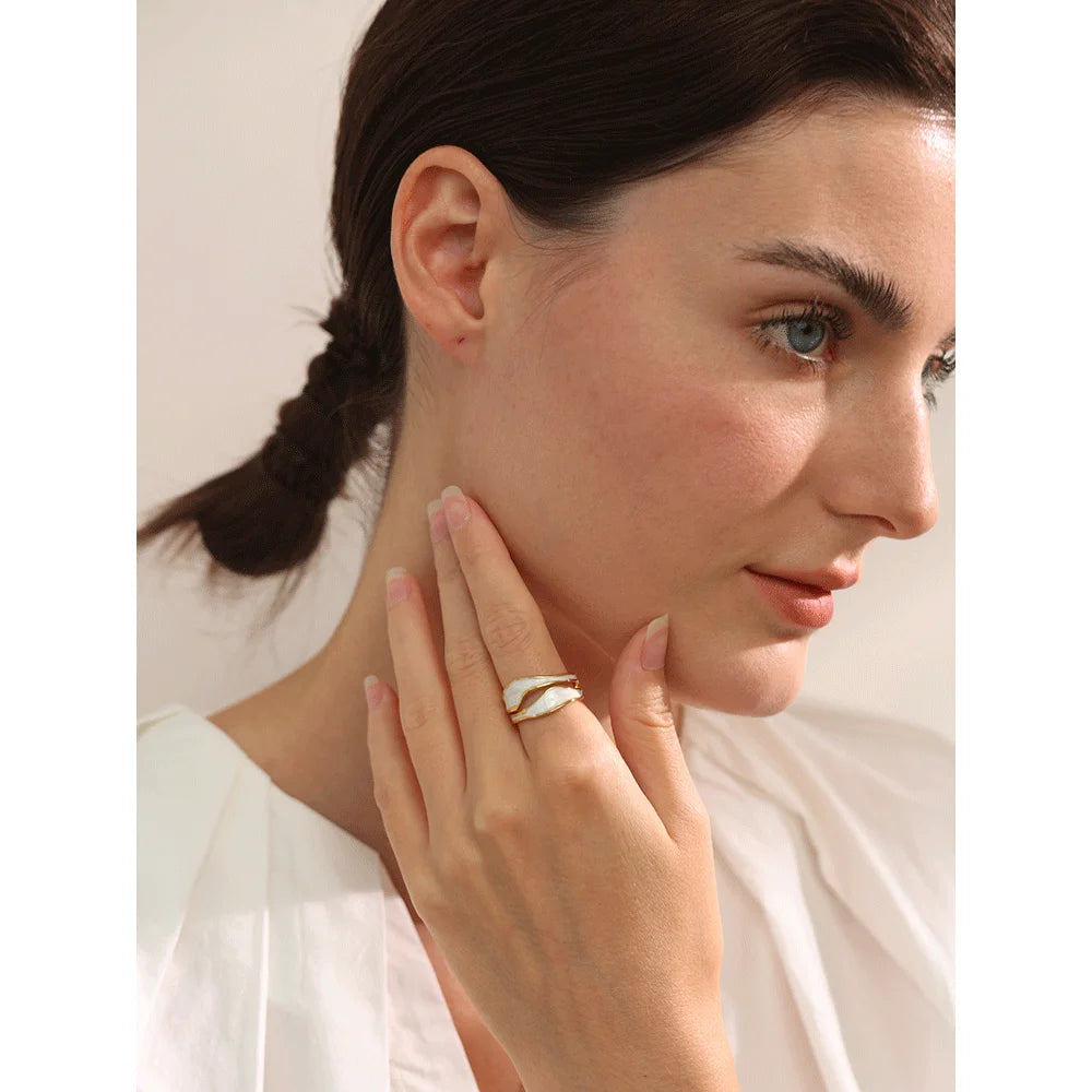 Alba ring close-up showing minimalist open-band design