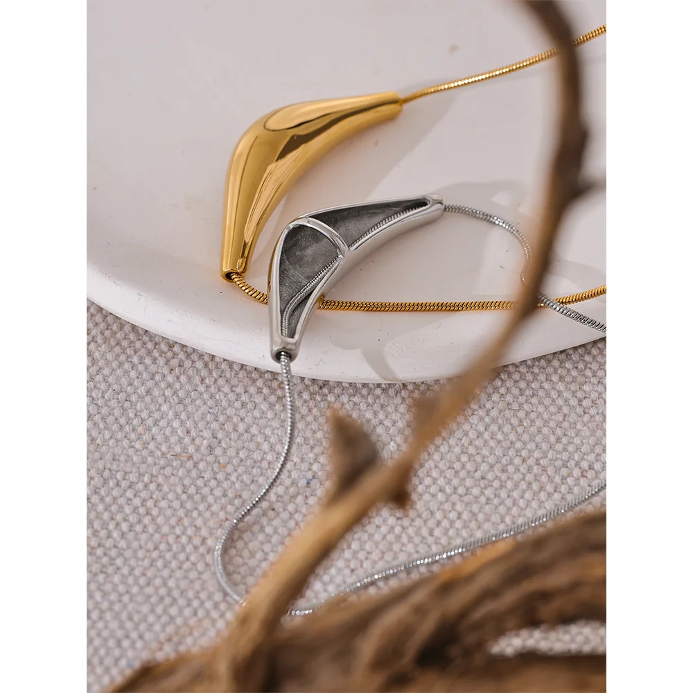Elara necklace detail view showing heart pendant