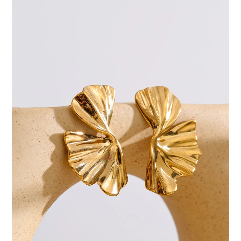 Close-up of polished gold-tone earring surface