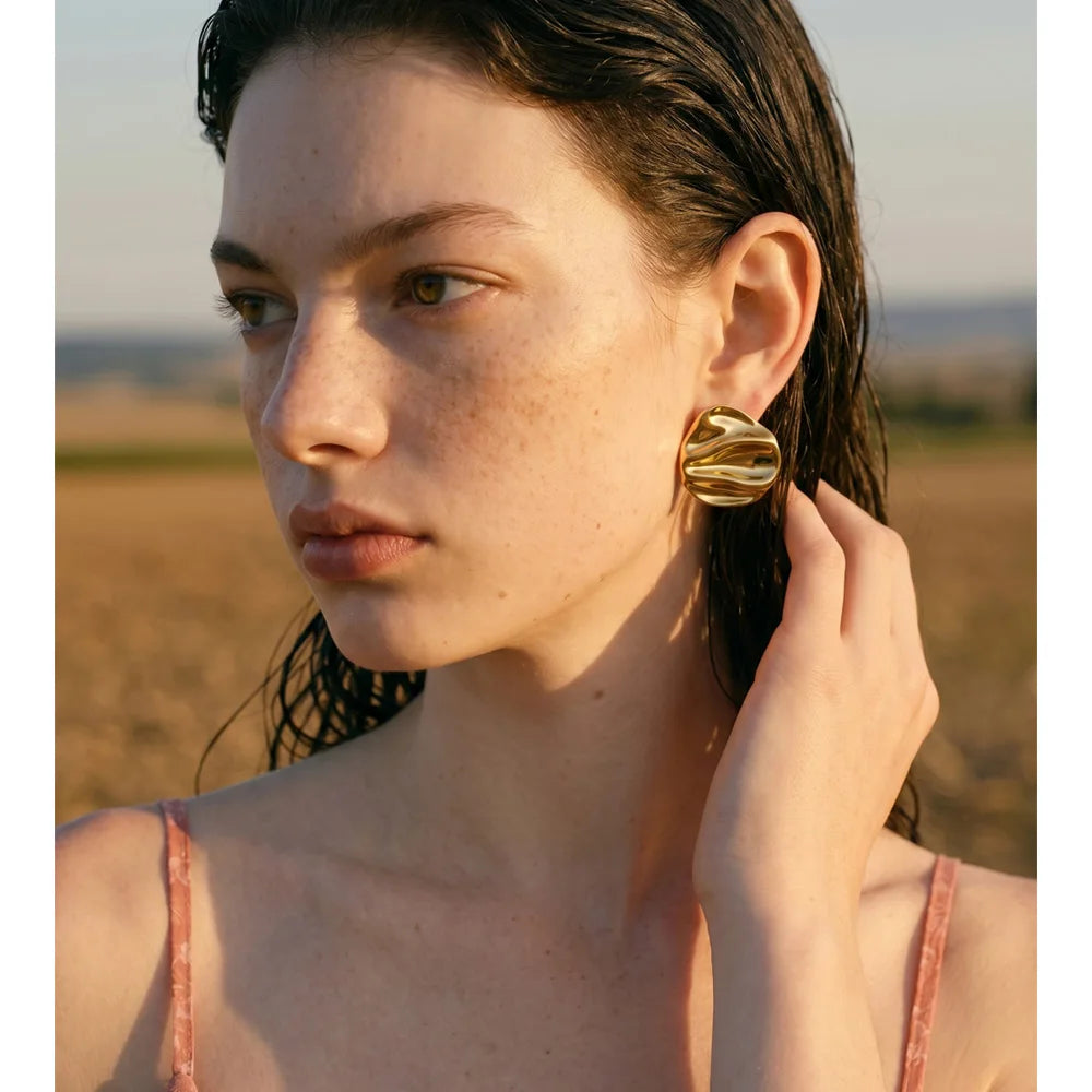 Zavelle earrings close-up showing textured oval detail