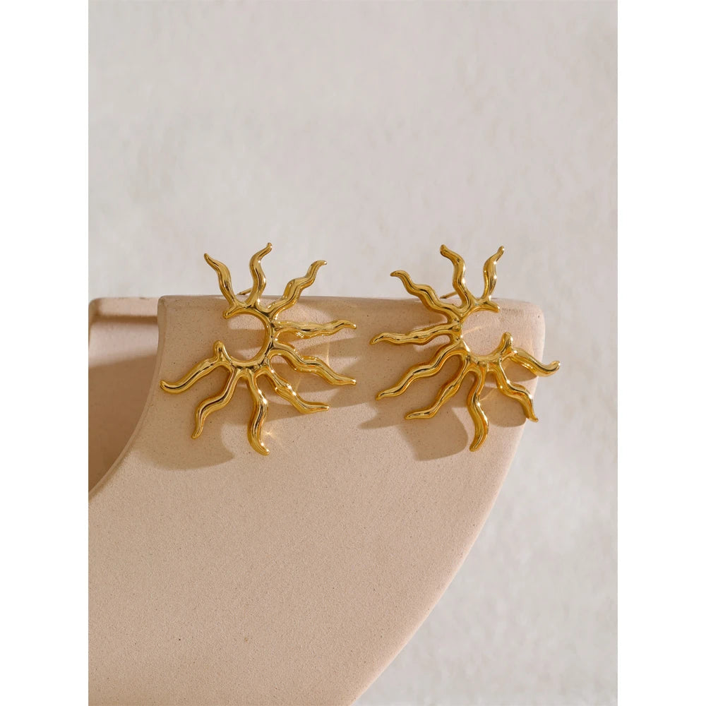 Solenne earrings detail view showing oval drop