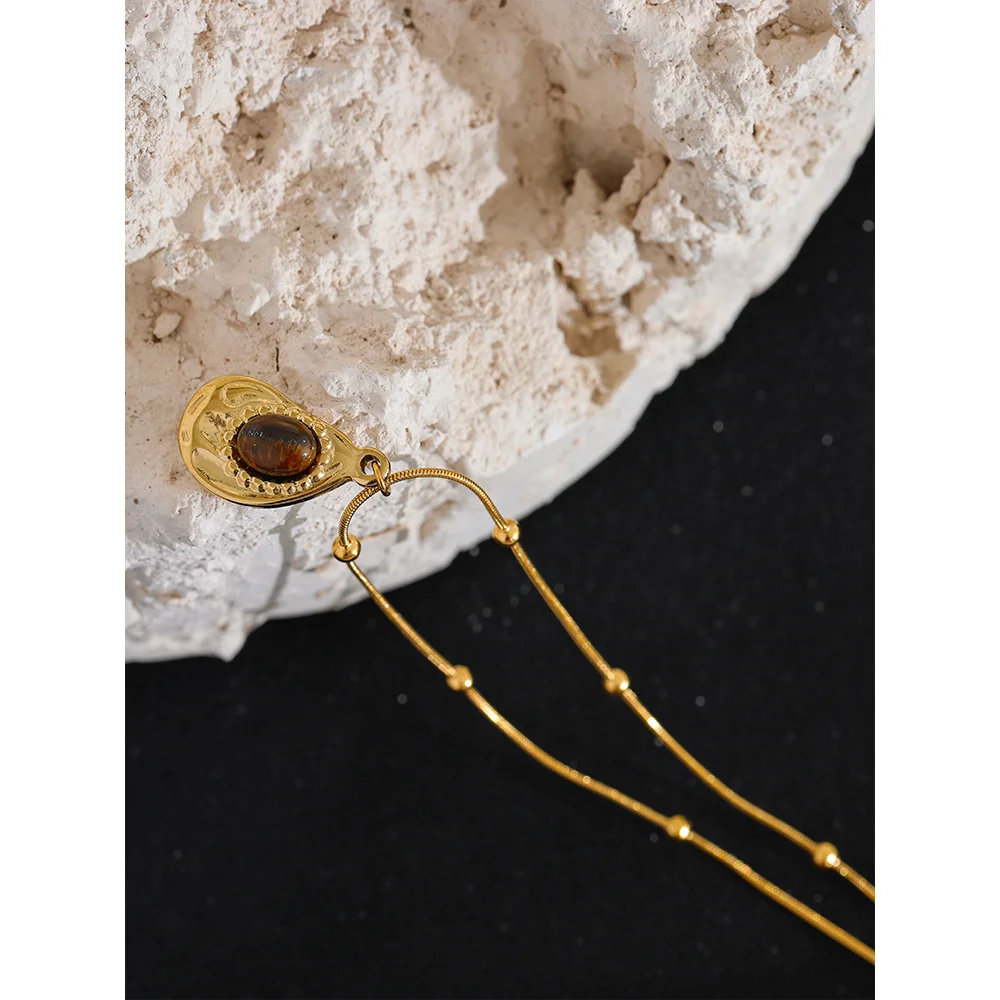 Close-up of polished gold-tone necklace surface