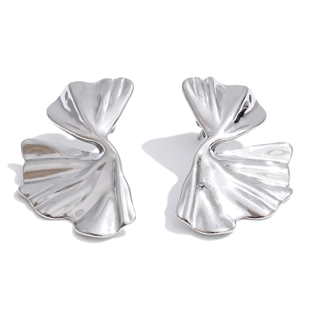Florisse earrings close-up showing textured oval detail