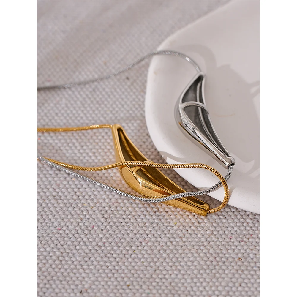 Close-up of polished gold-tone necklace surface
