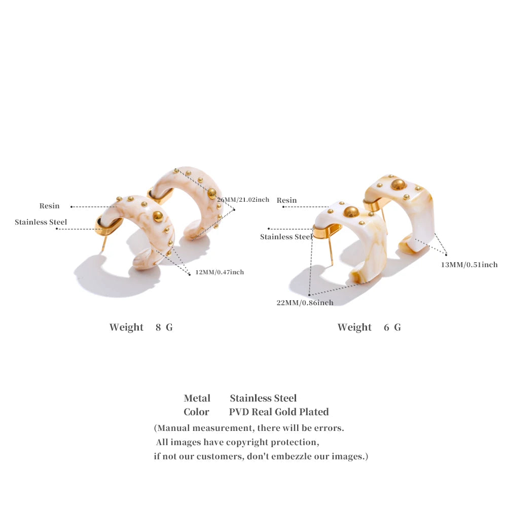 Ravella earrings displayed on a neutral background