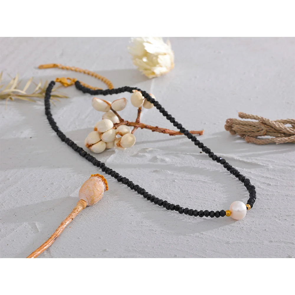 Noirelle necklace detail view showing oval pendant