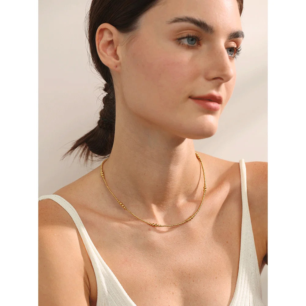 Marisol necklace close-up showing textured oval detail