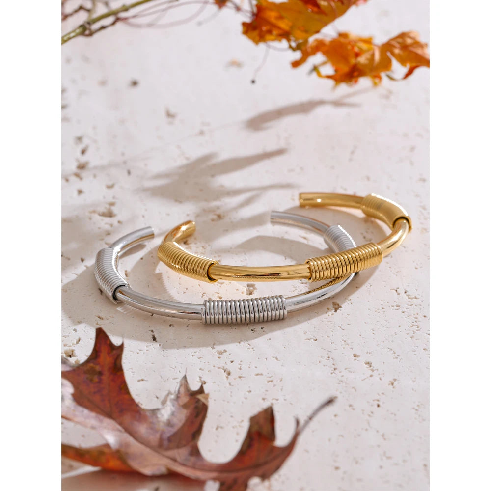 Nasim bracelet side view showing round cuff silhouette