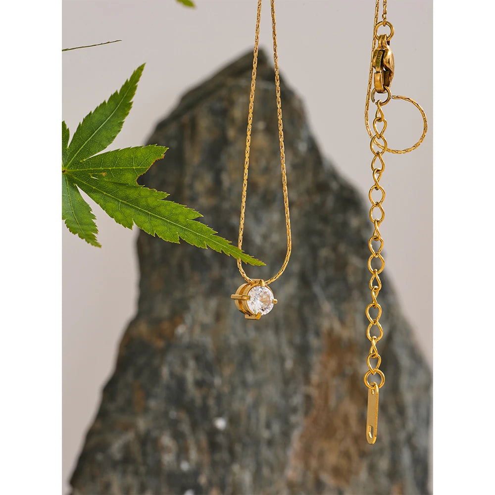 Zephyra necklace detail view showing oval pendant