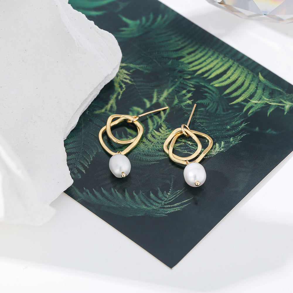 Close-up of polished gold-tone earring surface