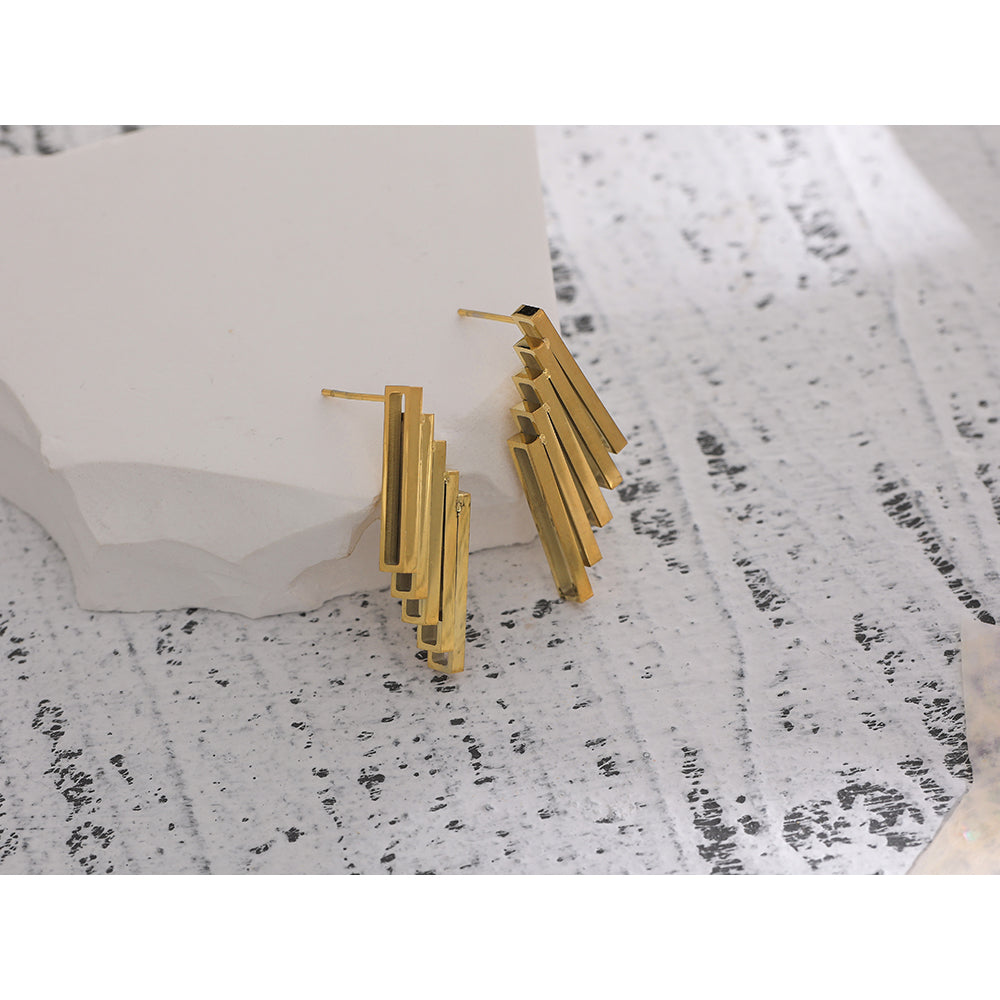 Zomorod earrings side view showing minimalist silhouette