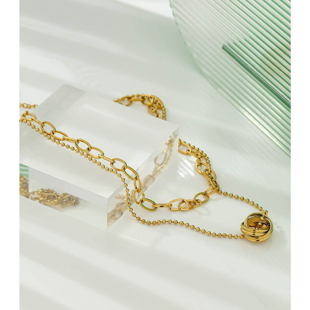 Close-up of polished gold-tone necklace surface