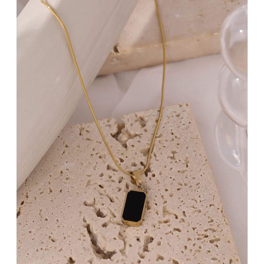 Close-up of polished gold-tone necklace surface