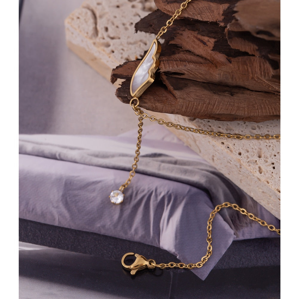 Barzan necklace close-up showing textured oval detail