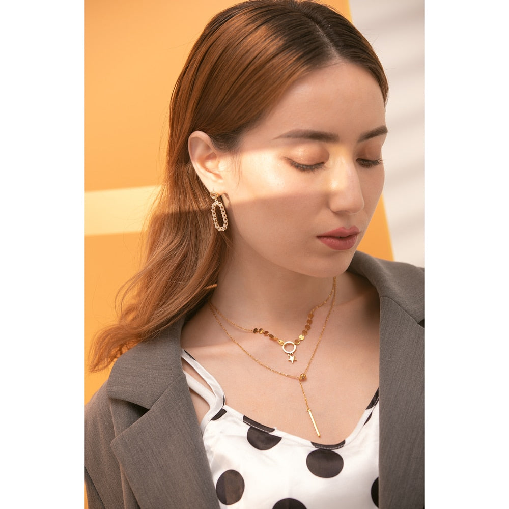 Rezvar necklace close-up showing textured oval detail
