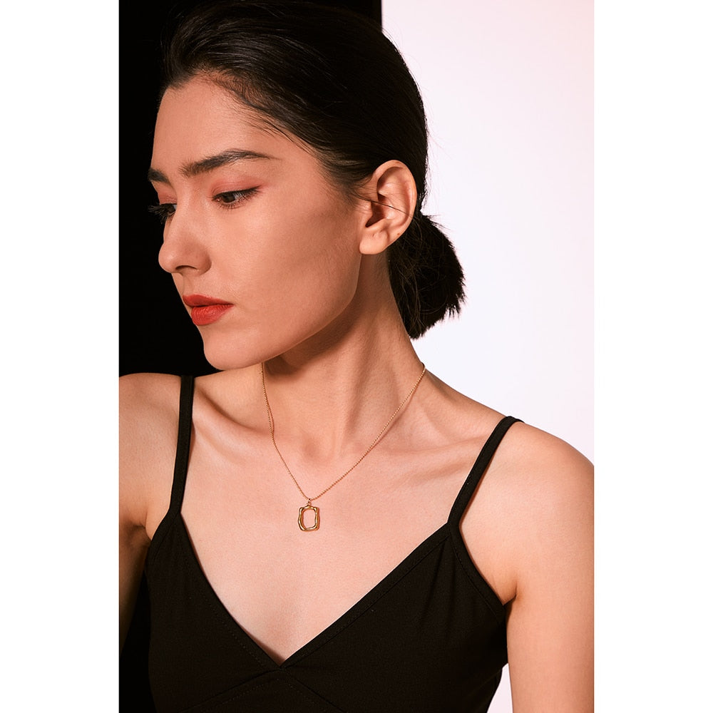 Sooran necklace close-up showing textured oval detail