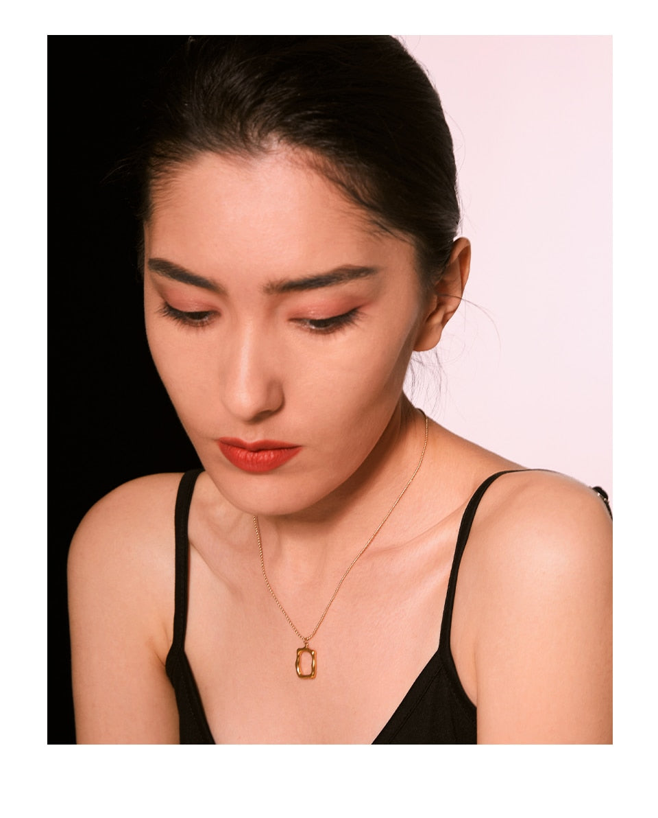 Close-up of polished gold-tone necklace surface