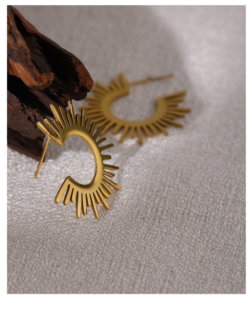 Close-up of polished gold-tone earring surface