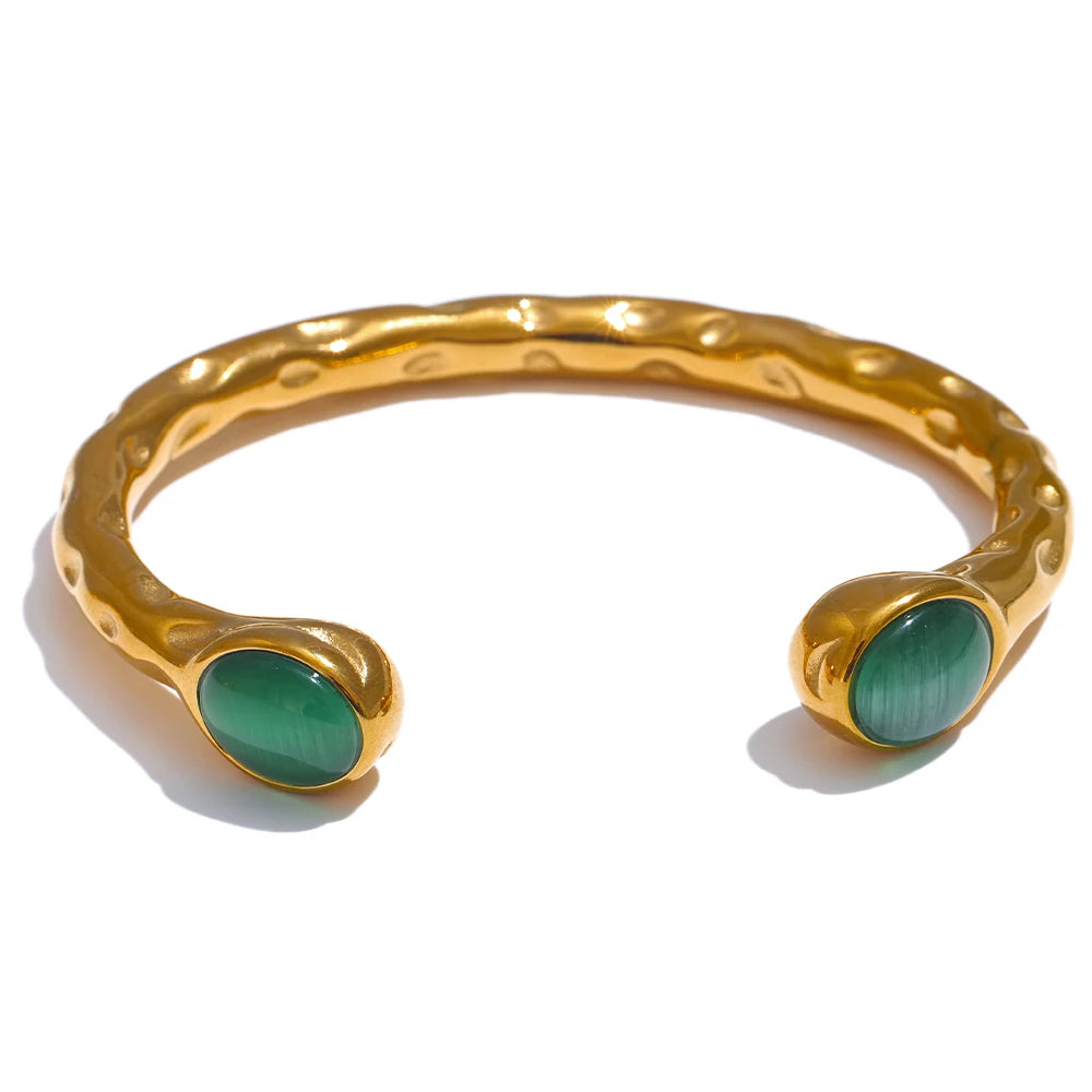Gold-tone open cuff bracelet with earthy stone details