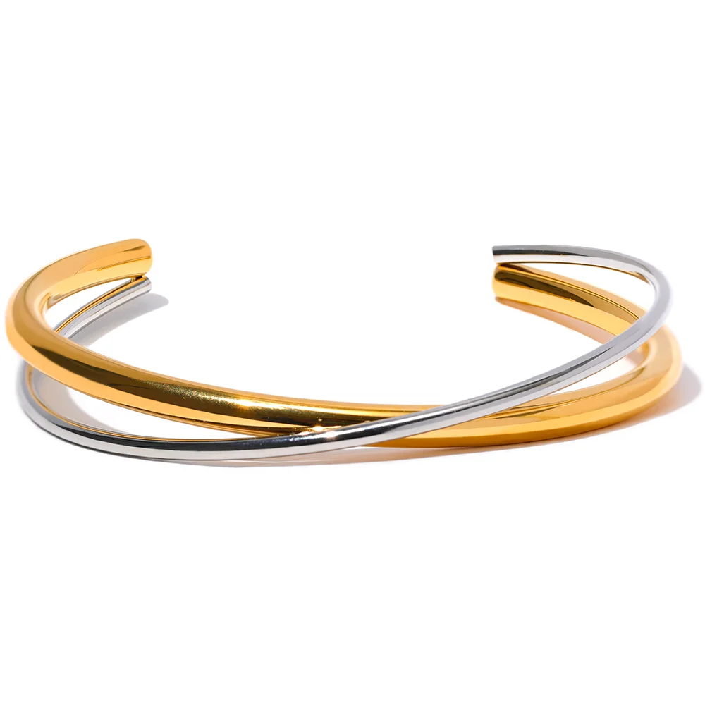 Gold and silver two-tone open cuff bracelet with sculptural geometric lines