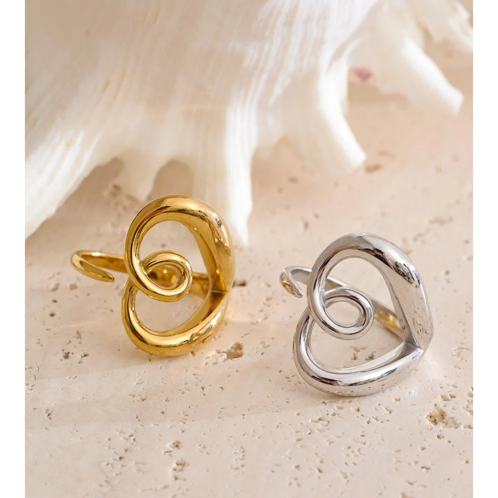 Silver stainless steel adjustable ring with hollow-heart detail