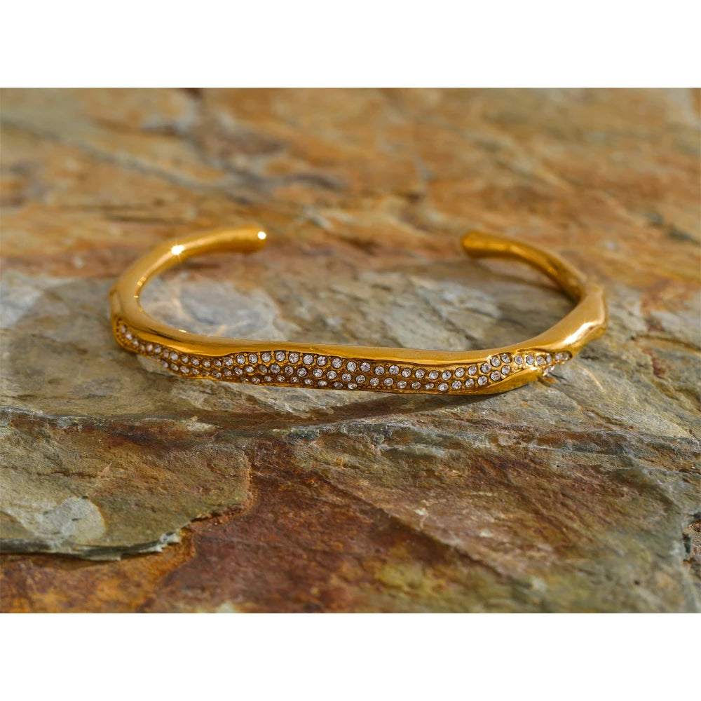 Close-up of polished gold-tone bracelet surface