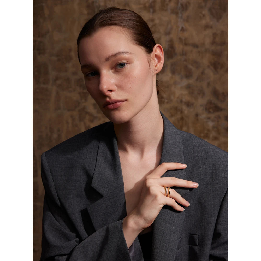 Luna ring close-up showing smooth minimalist band
