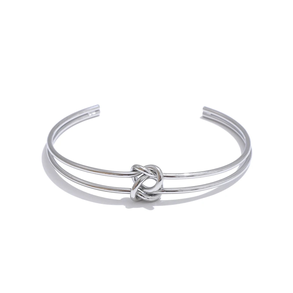 Gold stainless steel open cuff bracelet with knot-inspired detail