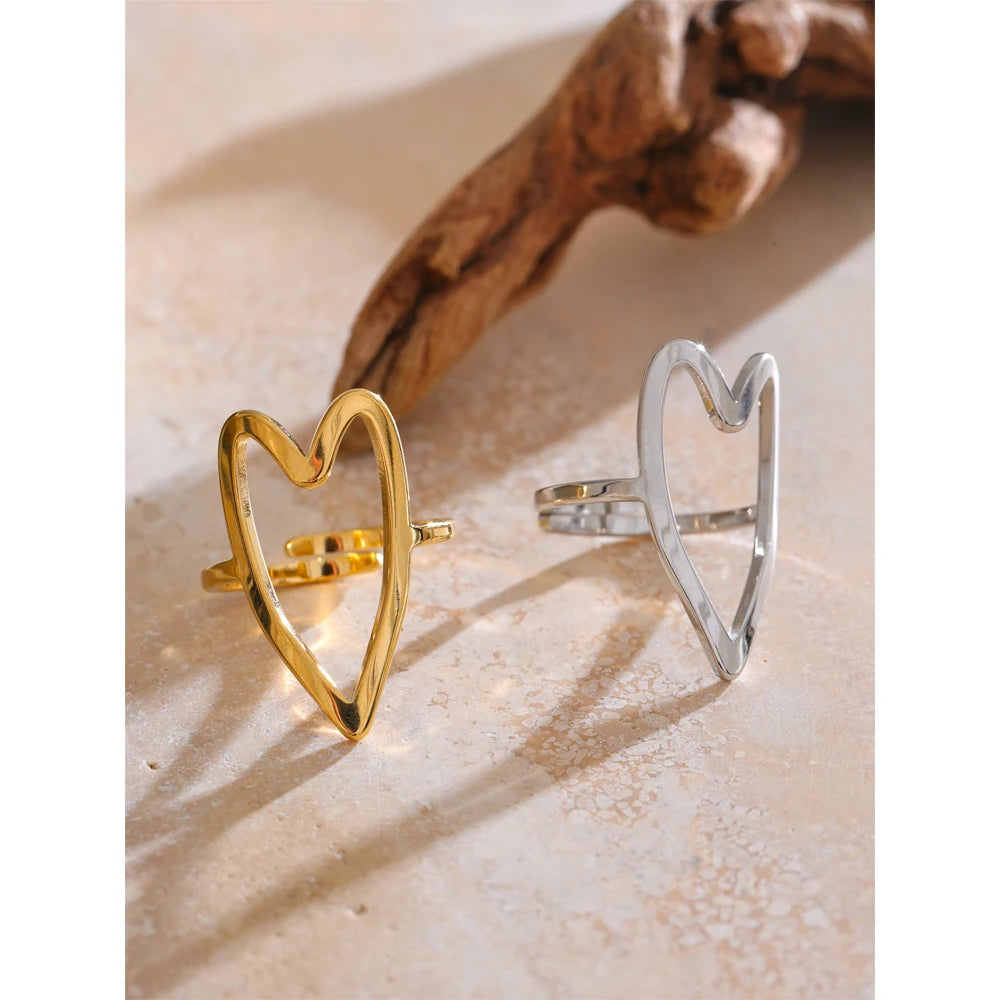 Silver stainless steel ring with polished hollow-heart design