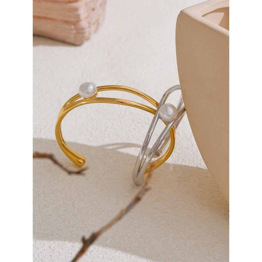 Silver stainless steel open cuff bracelet with pearl-inspired detail