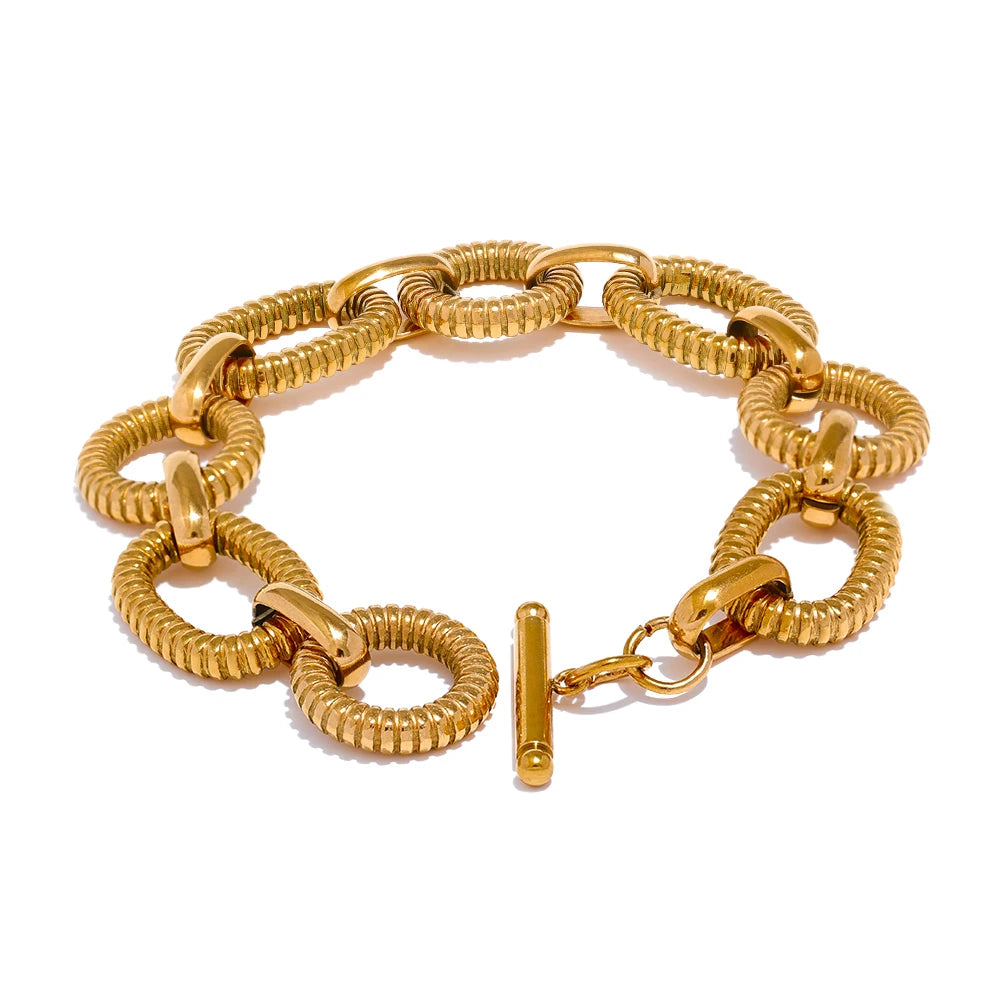Gold stainless steel oval-chain bracelet with textured finish and toggle clasp
