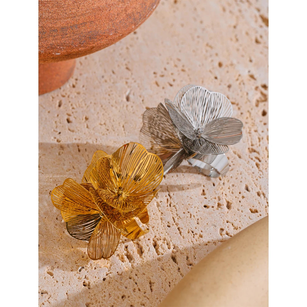 Silver stainless steel adjustable ring with flower-inspired detail
