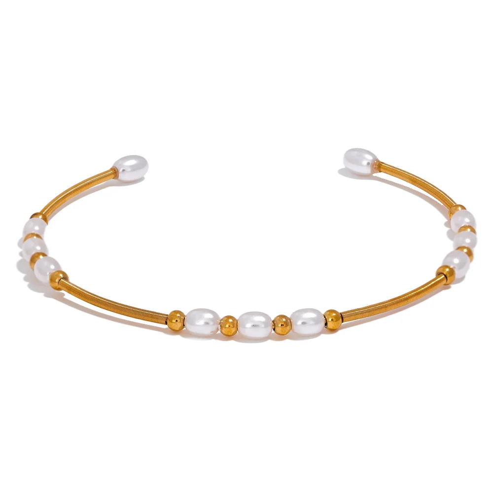 Gold stainless steel open cuff bracelet with imitation pearl detail