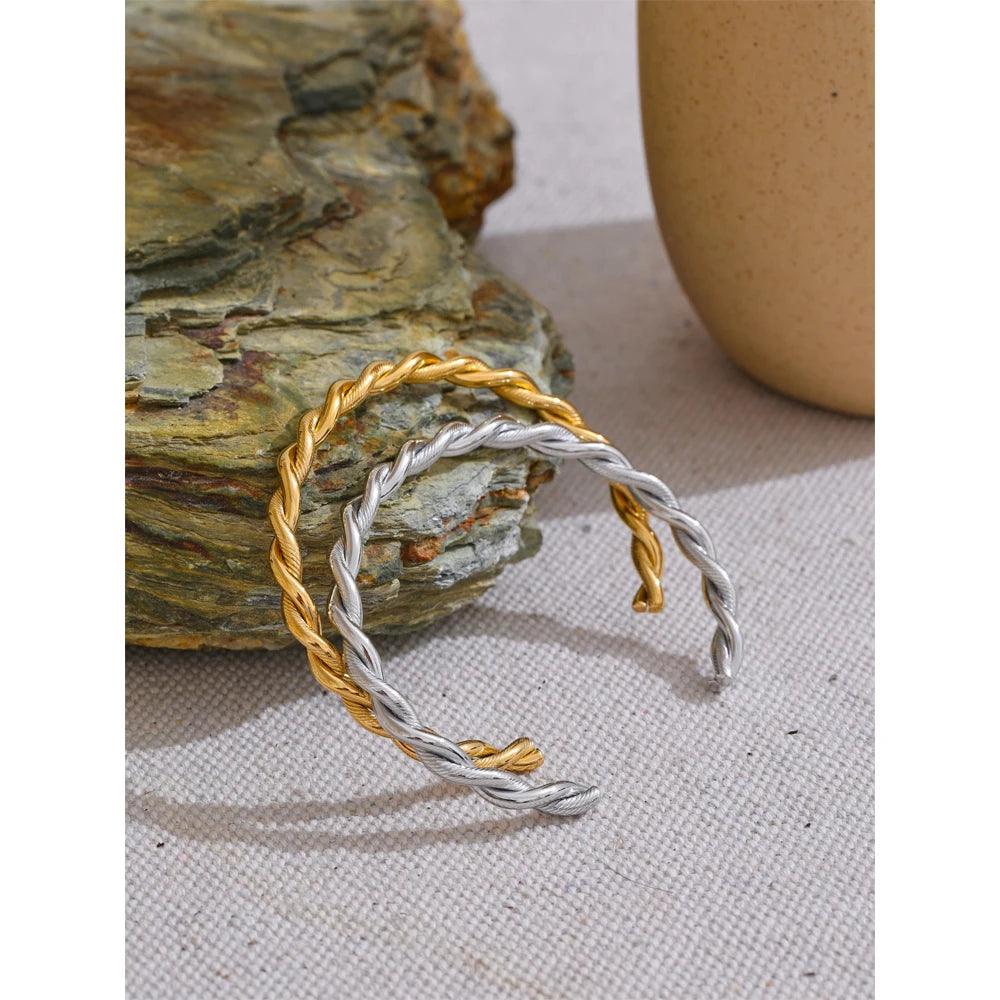 Rita bracelet close-up showing twisted open-cuff silhouette