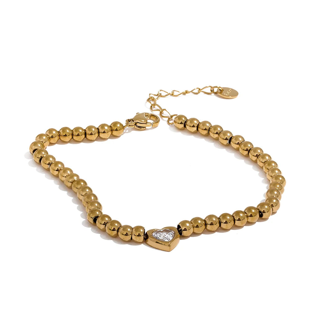 Gold stainless steel bead bracelet with heart-shaped zircon accent