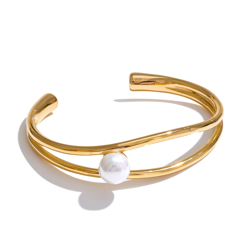 Gold stainless steel open cuff bracelet with pearl-inspired detail
